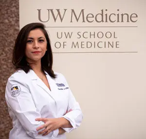 Cecilia Villa, UW Medicine student stands in front of UW Medicine sign.