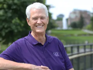 photo of John Laughlin in purple shirt near Drumhiller fountain