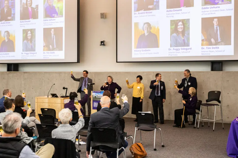 A toast to the new Health Sciences Education Building by the deans of the UW schools of social work, pharmacy, medicine, nursing, dentistry and public health. Students in the six health sciences schools will share a technologically sophisticated building with spaces and resources that promote active learning, interdisciplinary education and collaboration.