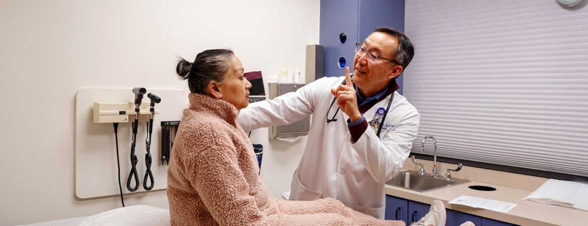 Dr. Thomas Hei with a patient during an appointment