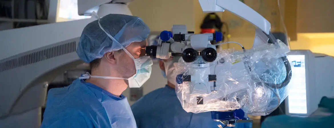 Dr. Andrew Stacey performing surgery.