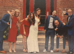 Kim Czepiga, her husband, their four children and her son-in-law at her daughter's wedding.