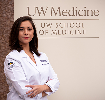 Cecelia Villa, in front of a sign that reads "UW School of Medicine"