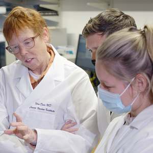 Dr. Nora Disis in a lab at the Cancer Vaccine Institute with fellow researchers