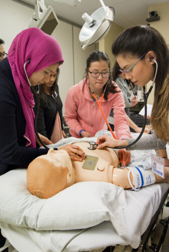 First year medical students learn how to respond to an obstructed airway during the Foundations of Clinical Medicine class in WISH (WWAMI Institute for Simulation in Healthcare) at Harborview Medical Center.