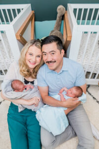 Jessie Owen, with her husband and their twin babies, at home in their children's bedroom.