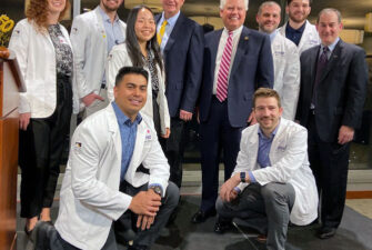 Medical students posing with UW School of Medicine leaders