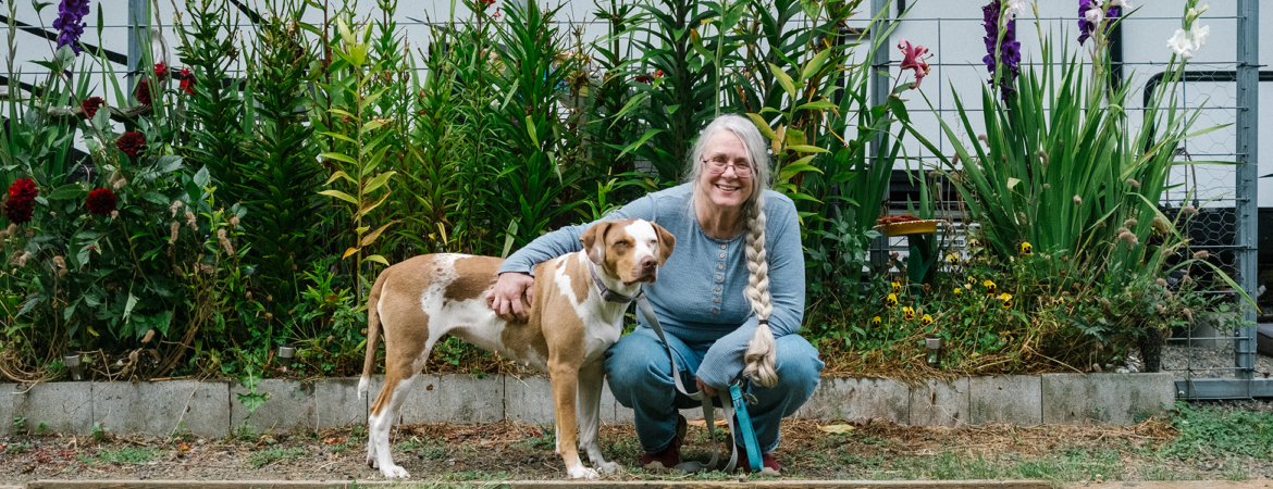 Pat Thorp outside with her dog