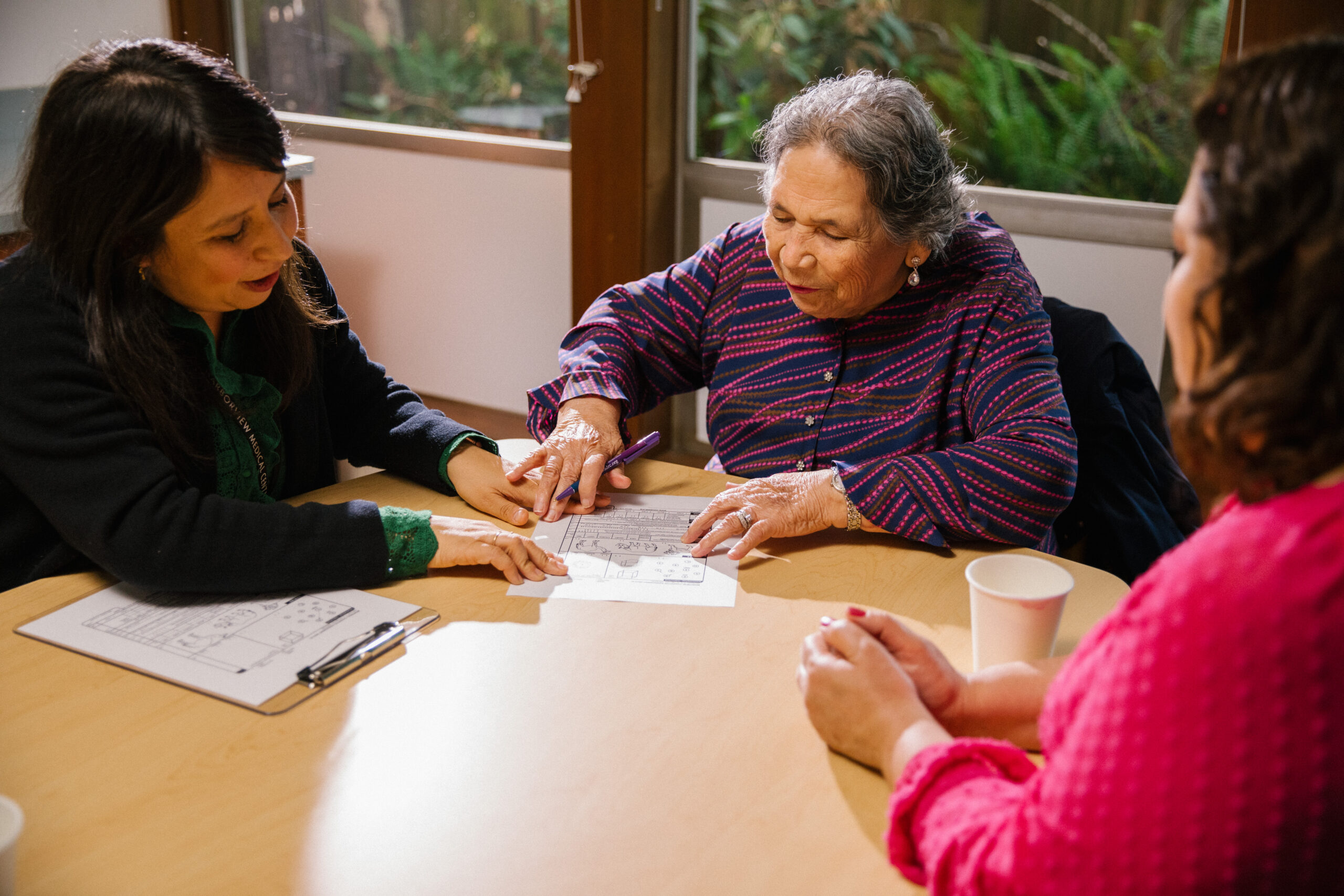 A clinician works with a patient at the Memory and Brain Wellness Center (MBWC).