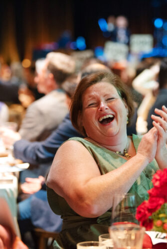 Attendee laughing during The Benefit 2024