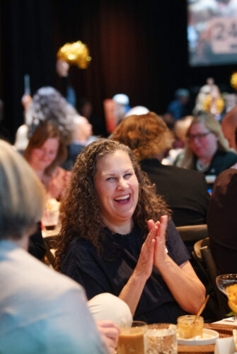 Attendee laughing during The Benefit 2024