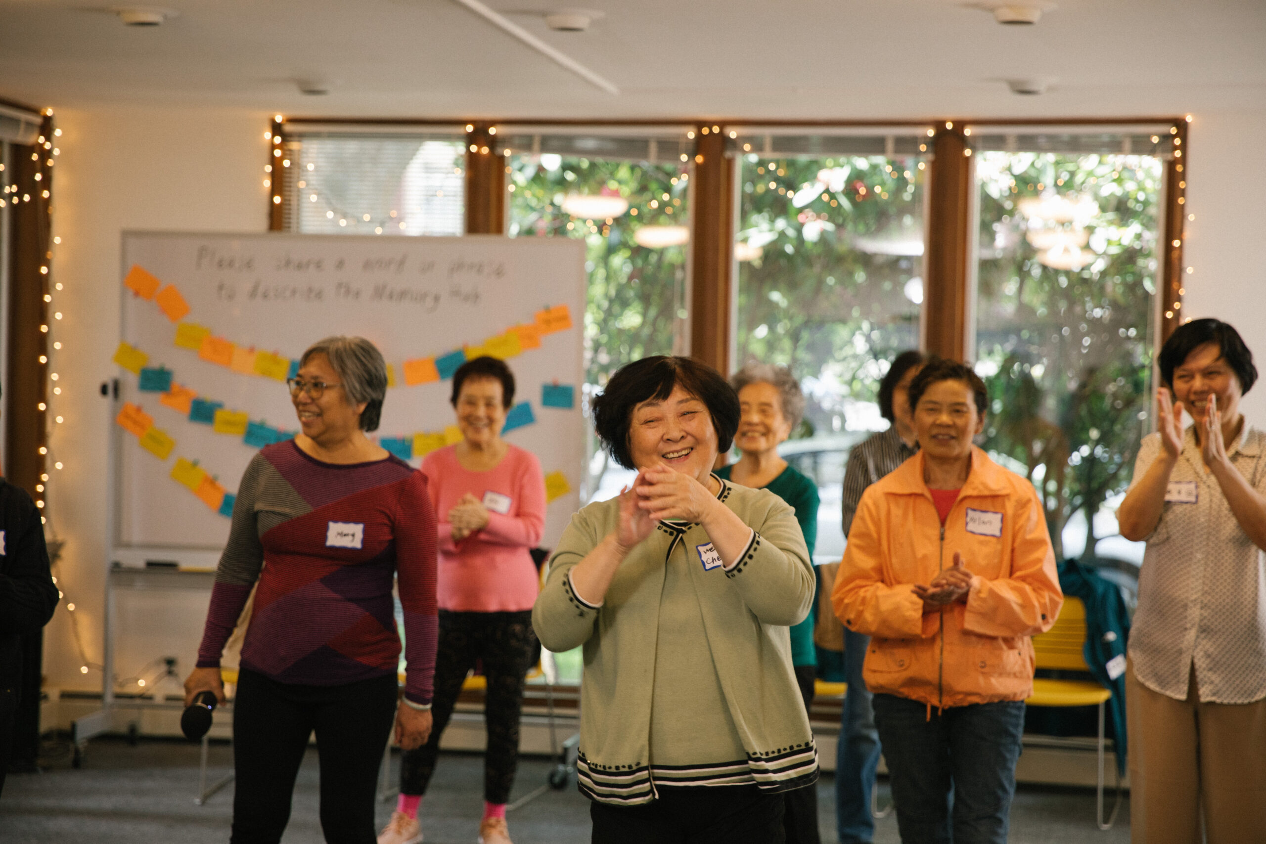 Visitors participating in a karaoke and tai chi program at the Memory Hub.