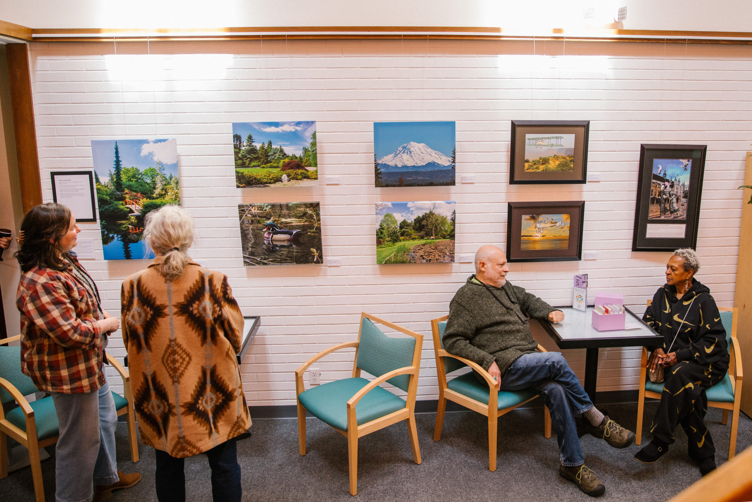 An exhibit called “Frame of Mind” hanging in the atrium of the Memory Hub, which features artwork created by people with memory loss and dementia.