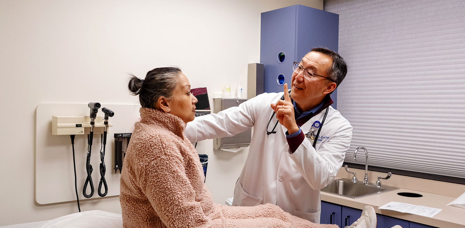 Dr. Thomas Hei examining a patient.