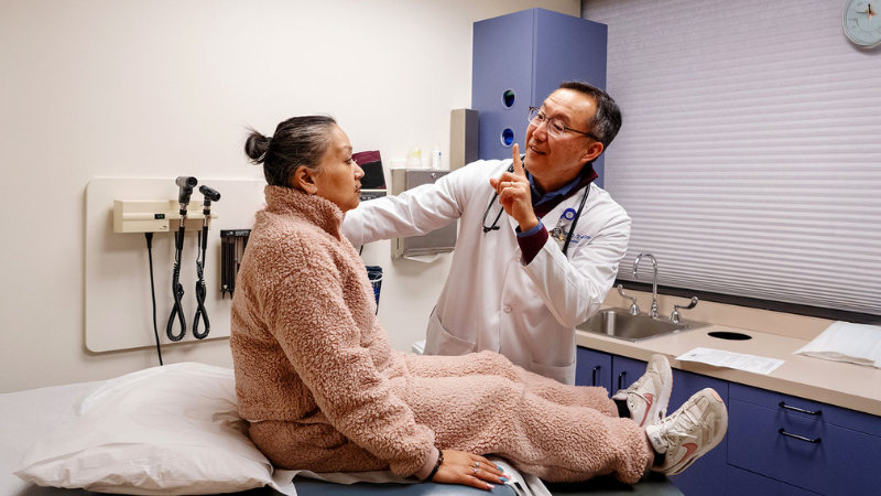 Dr. Thomas Hei with a patient